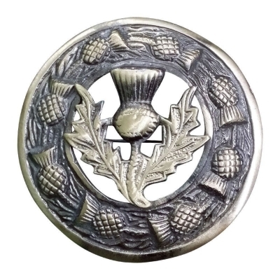 An antique finish fly plaid brooch featuring a thistle ring with thistle crest